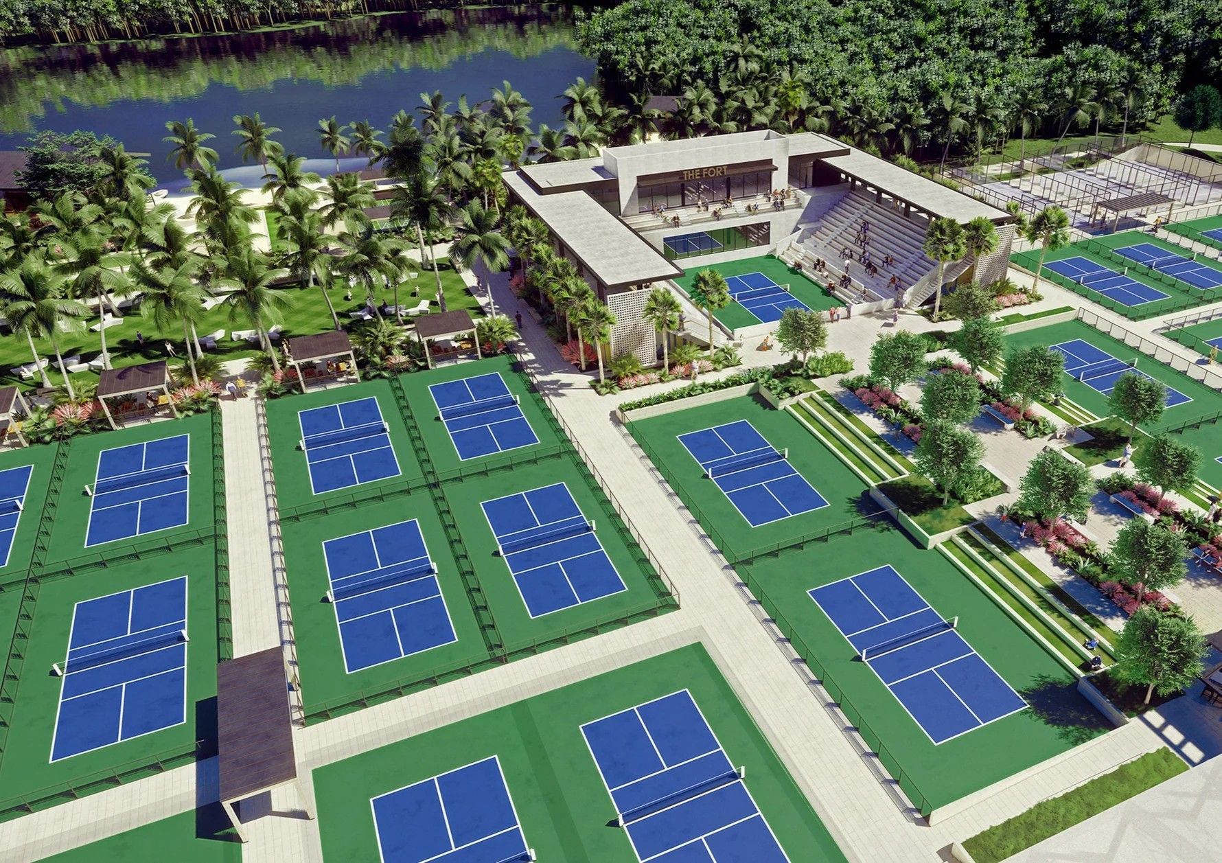 Aerial view of a tennis complex with blue courts, a central clubhouse, and palm trees near a river.