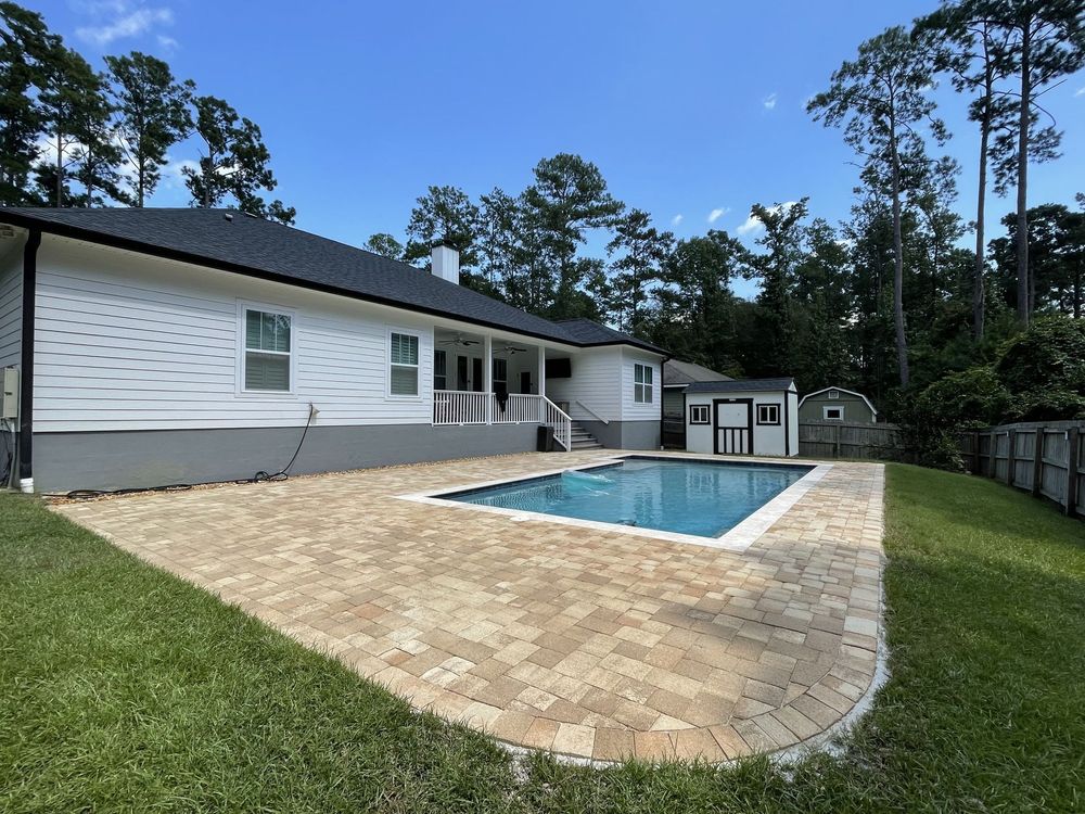 A house with a large swimming pool in the backyard