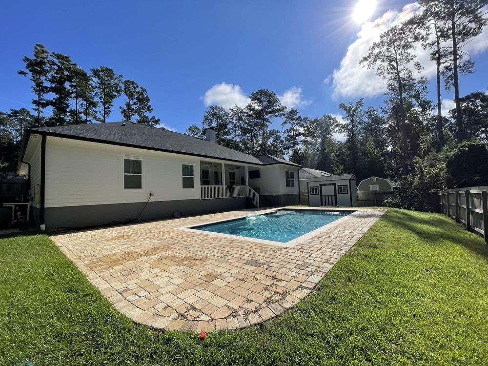 A house with a large swimming pool in the backyard