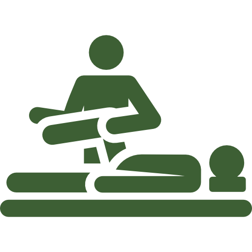 A person is laying on a bed getting a massage.