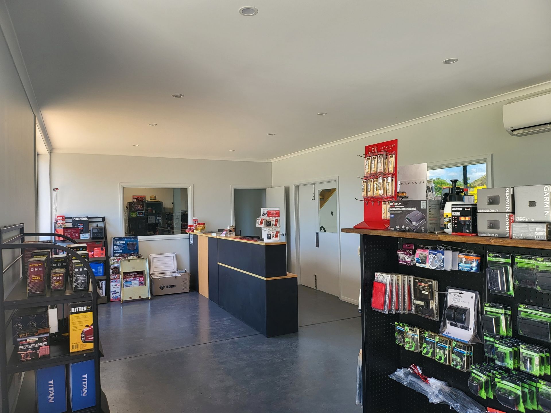 A Store Filled With Lots of Shelves and a Counter — Sam’s Auto Electrical In Golden Square, VIC