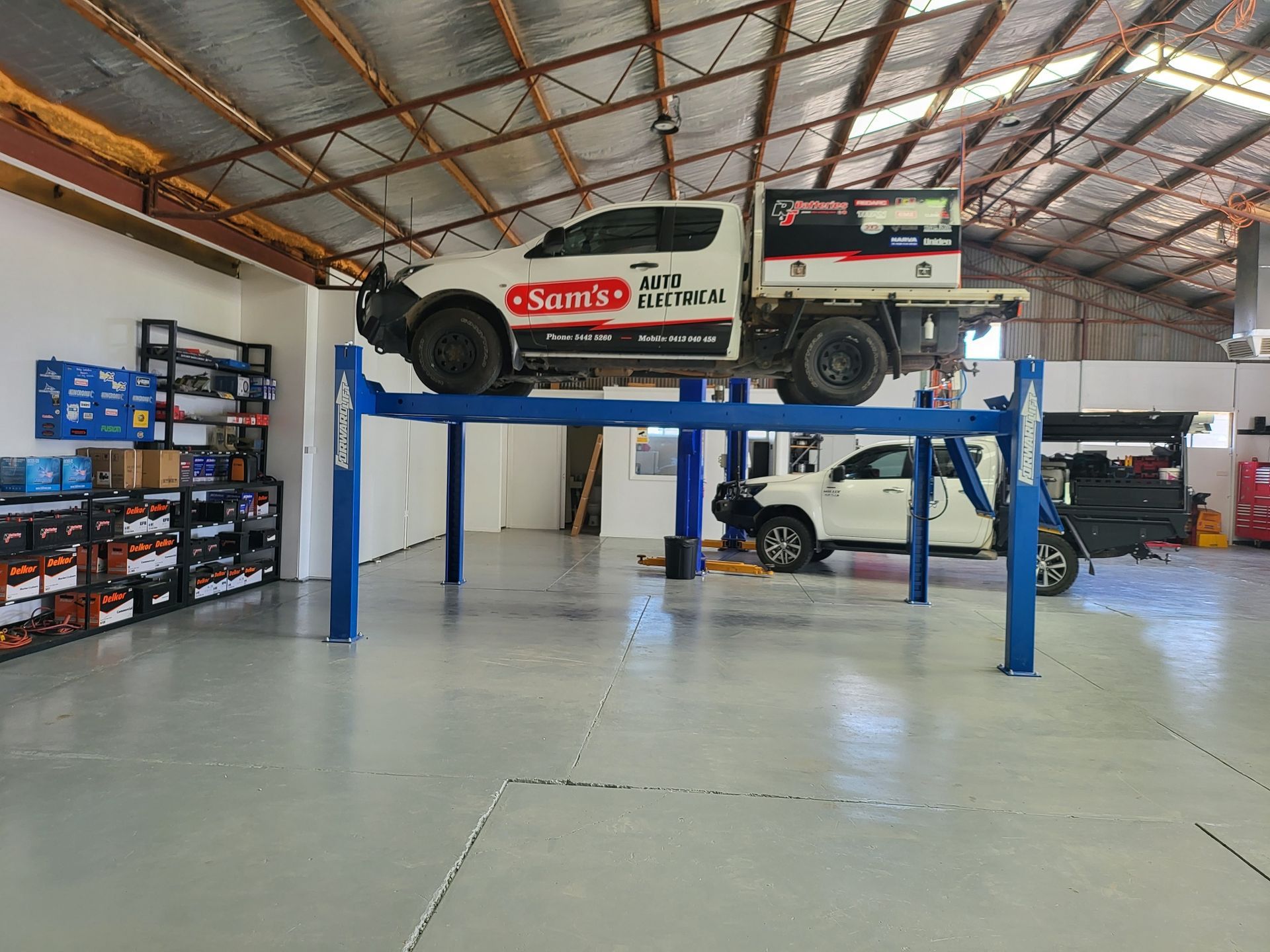 A Row of Shelves Filled With Batteries — Sam’s Auto Electrical In Golden Square, VIC
