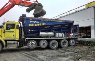 Gravel — Delivering Rocks into a Building in Puyallup, WA
