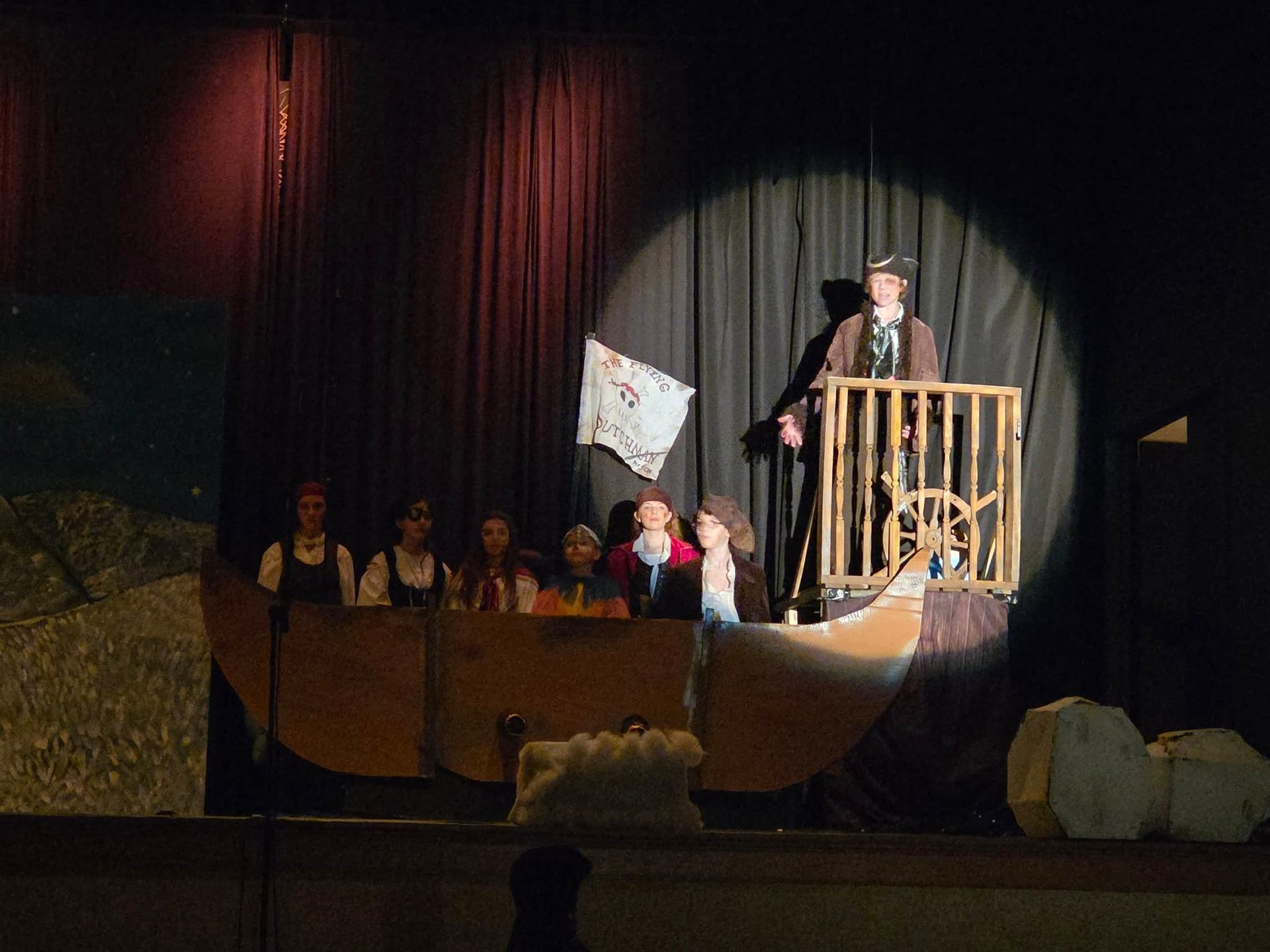 Baseball player sliding into base as another player attempts to catch the ball.