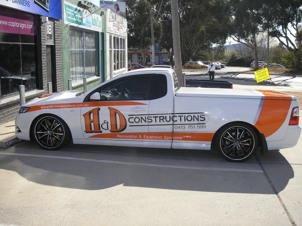 A White Truck With The Word Constructions On It — Capital Signs in Cooma, NSW
