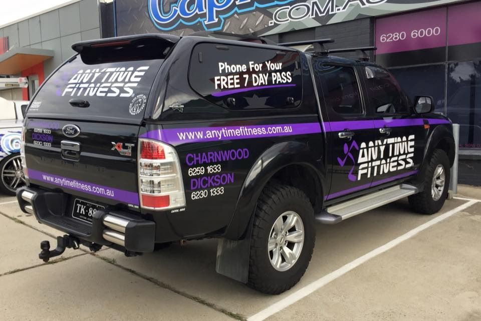 A Black And Purple Truck Is Parked In A Parking Lot In Front Of A Gym — Capital Signs in Goulburn, NSW