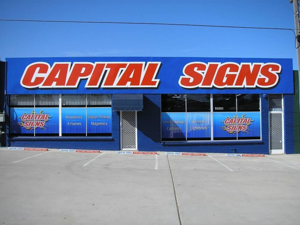A Capital Signs Store With A Parking Lot In Front Of It — Capital Signs in Cooma, NSW