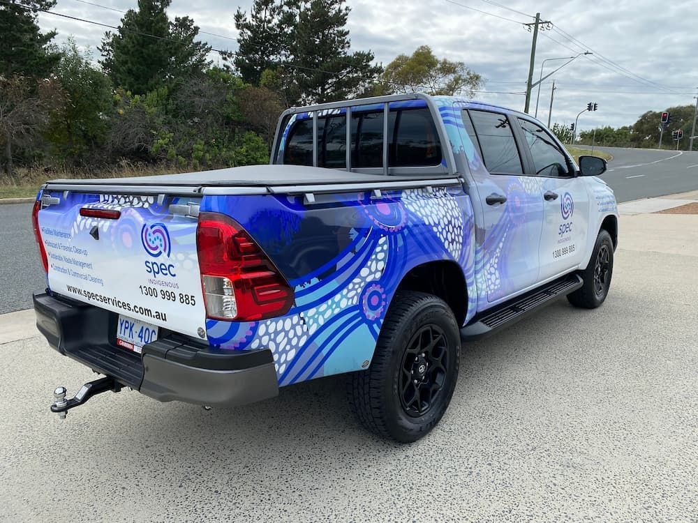 A Blue And White Truck Is Parked On The Side Of The Road — Capital Signs in Goulburn, NSW