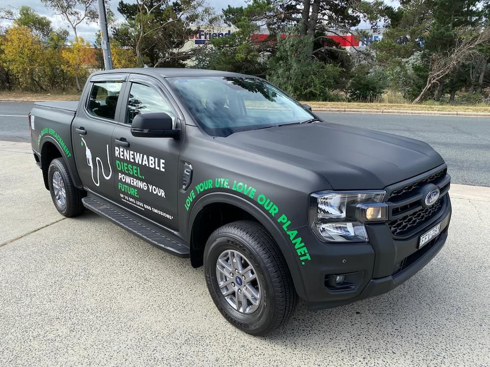 A Black Truck Is Parked On The Side Of The Road — Capital Signs in Fyshwick, ACT