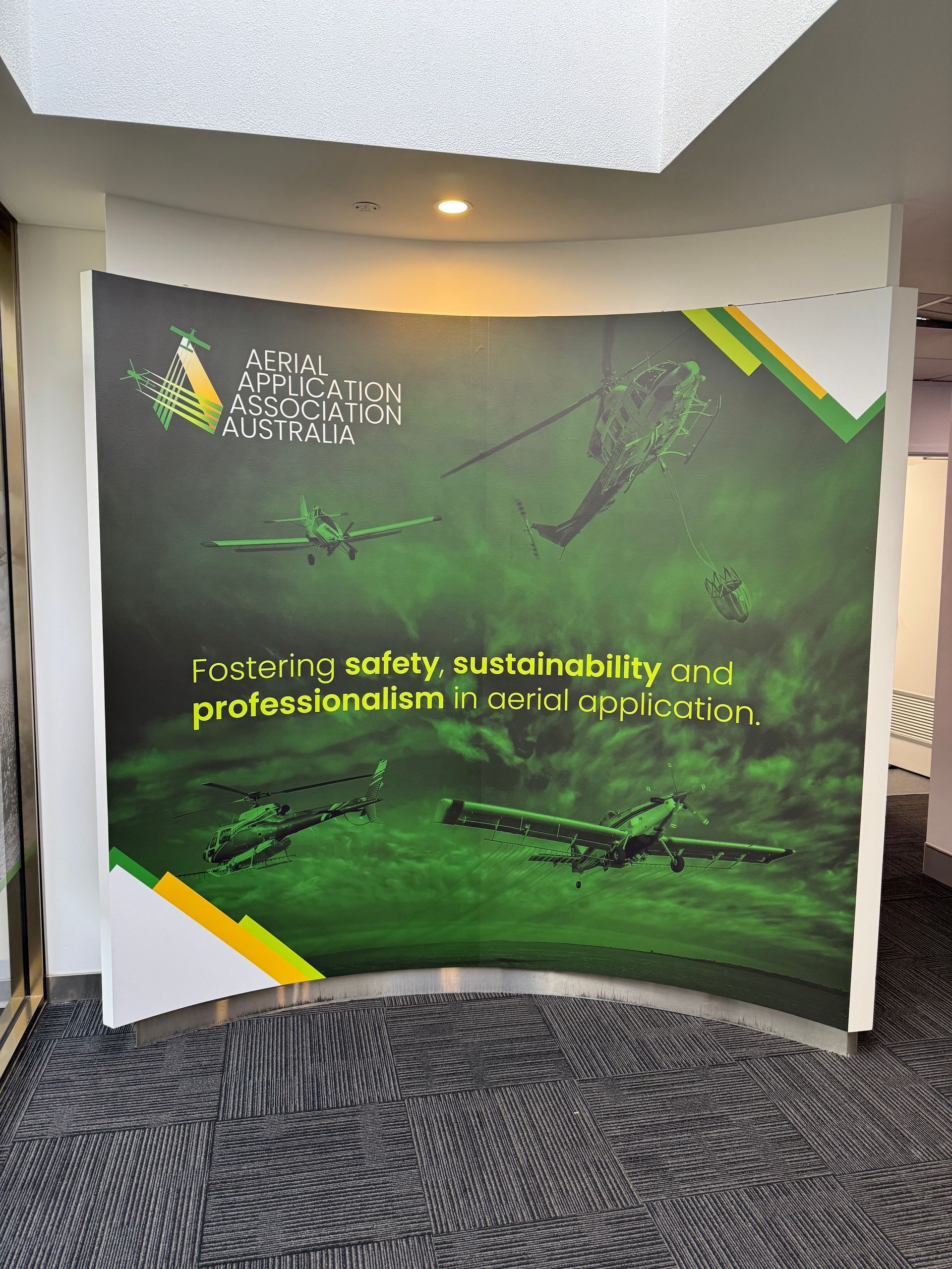 Curved display featuring an aviation graphic, the text 