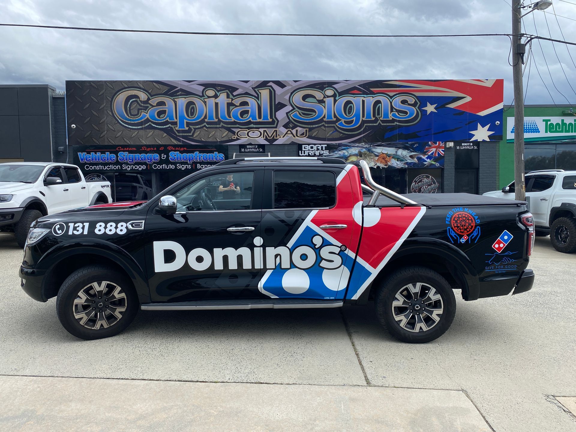 A Black Ute with Domino's logo on it  — Capital Signs in Fyshwick, ACT
