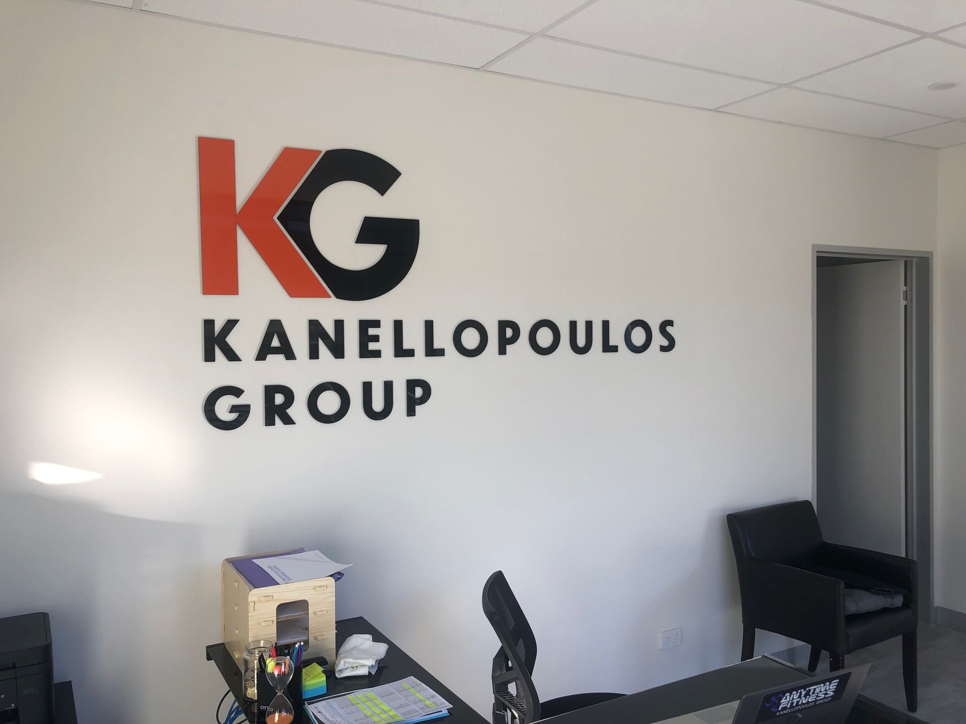 Logo for Kanellopoulos Group: Orange and black
