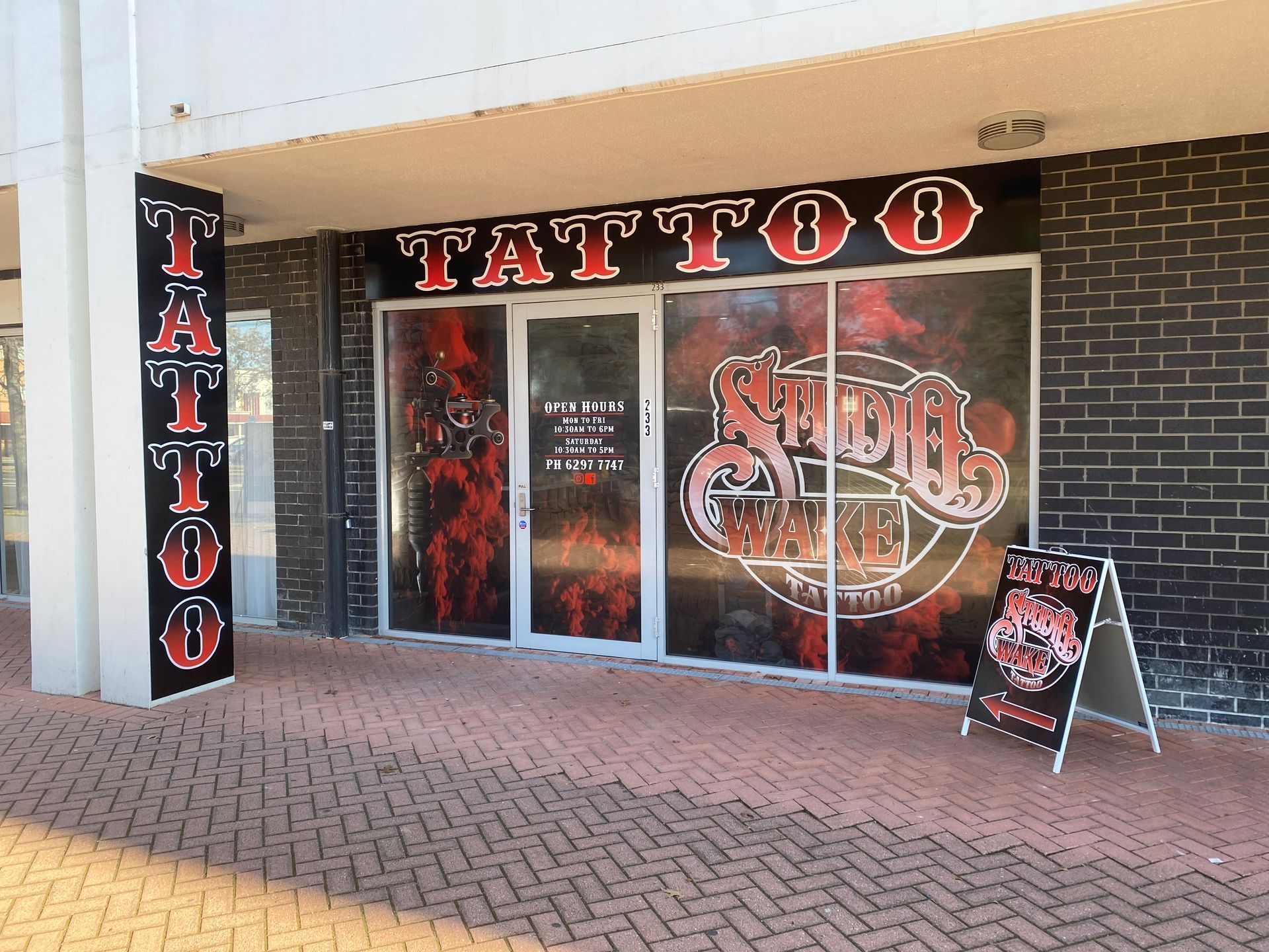 Tattoo shop signage . Text Reads 