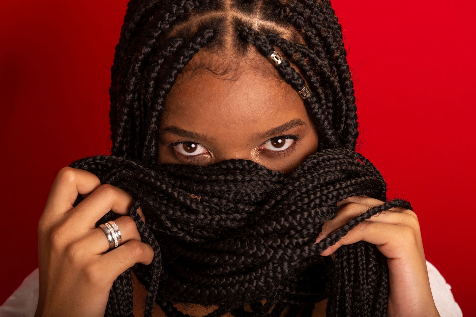 Woman Covering Her Face with Her Braided Hair