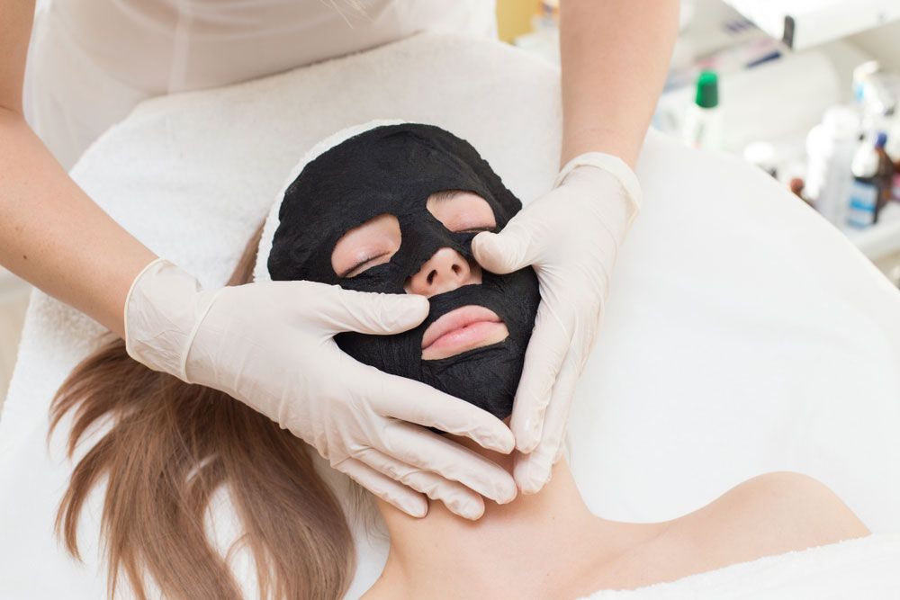 Woman wearing a black mask for facial treatment — Shepparton Skin & Body