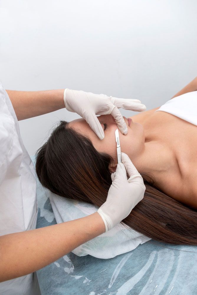 Woman getting dermaplaning treatment — Shepparton Skin & Body