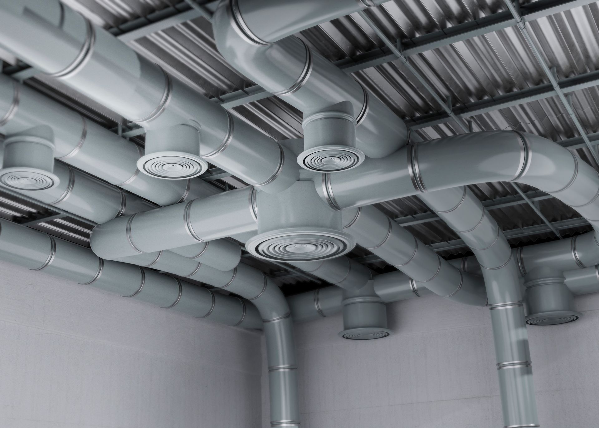 A room with a lot of pipes coming out of the ceiling.