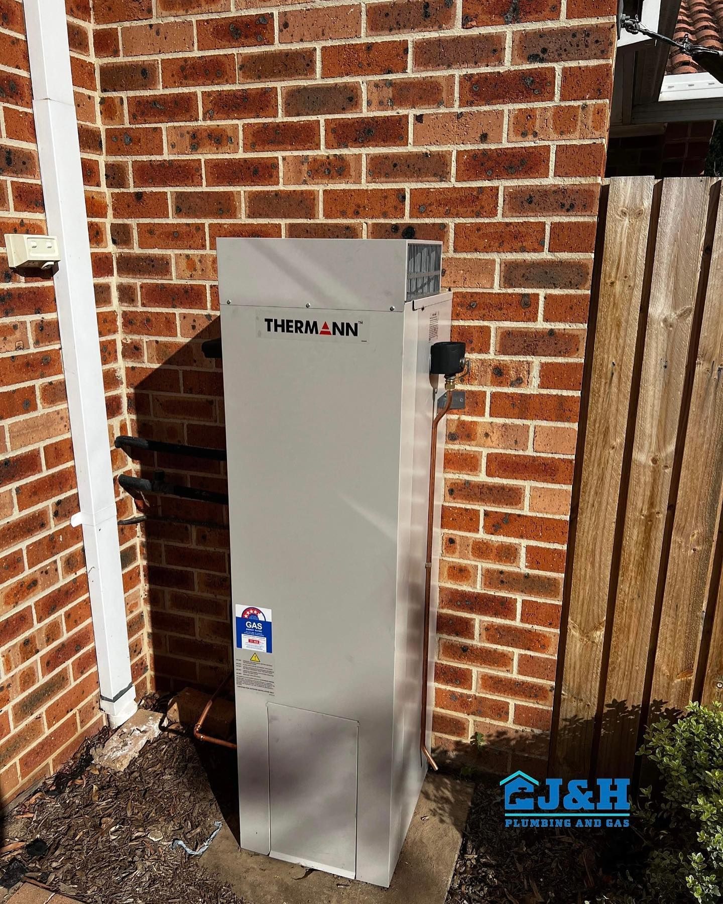 Blue Water Filtration and Heating System in A Utility Room — J & H Plumbing and Gas in Holt, ACT