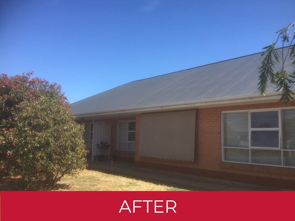 A picture of a house after being painted white