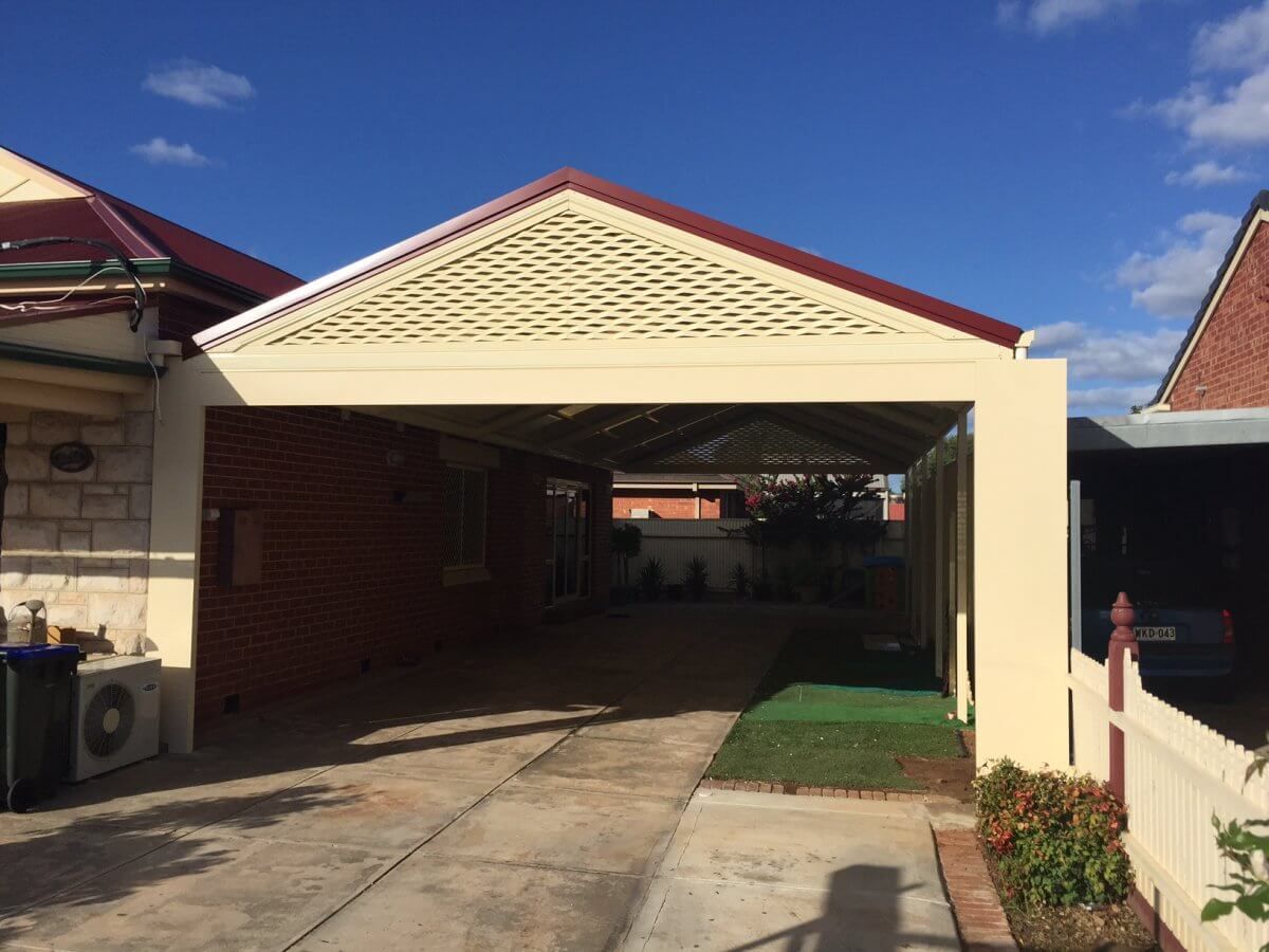 A house with a carport in front of it