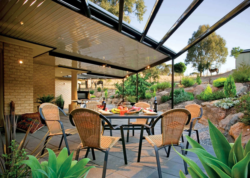 A patio with a table and chairs