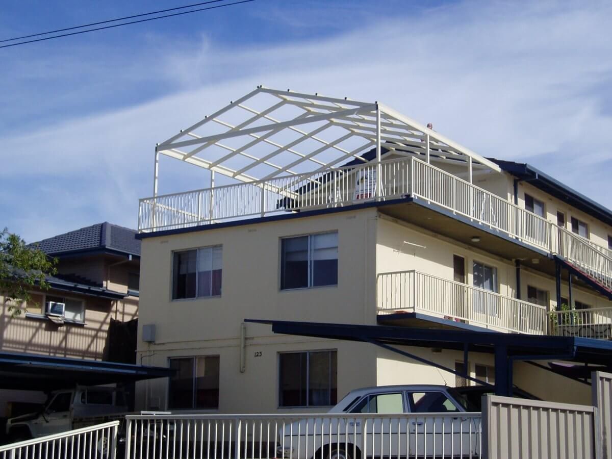 A house with a car parked in front of it