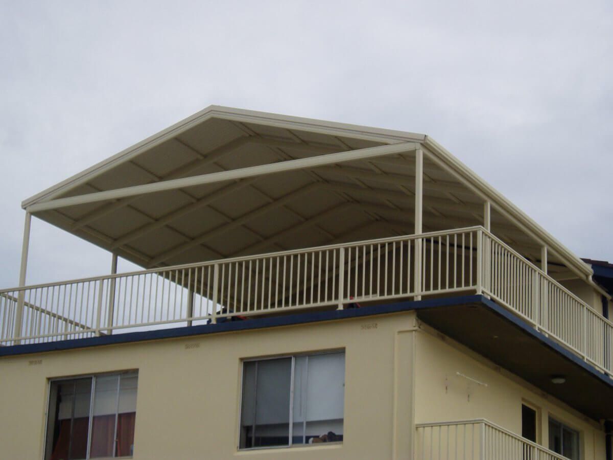 A house with a balcony on the top of it