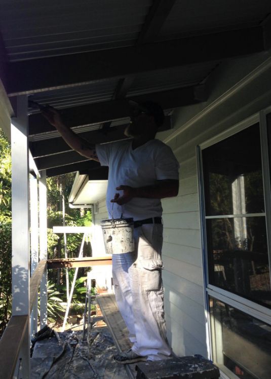 Worker Painting Roof — Painting, Plastering & Roof Restoration in Mooloolah Valley, QLD