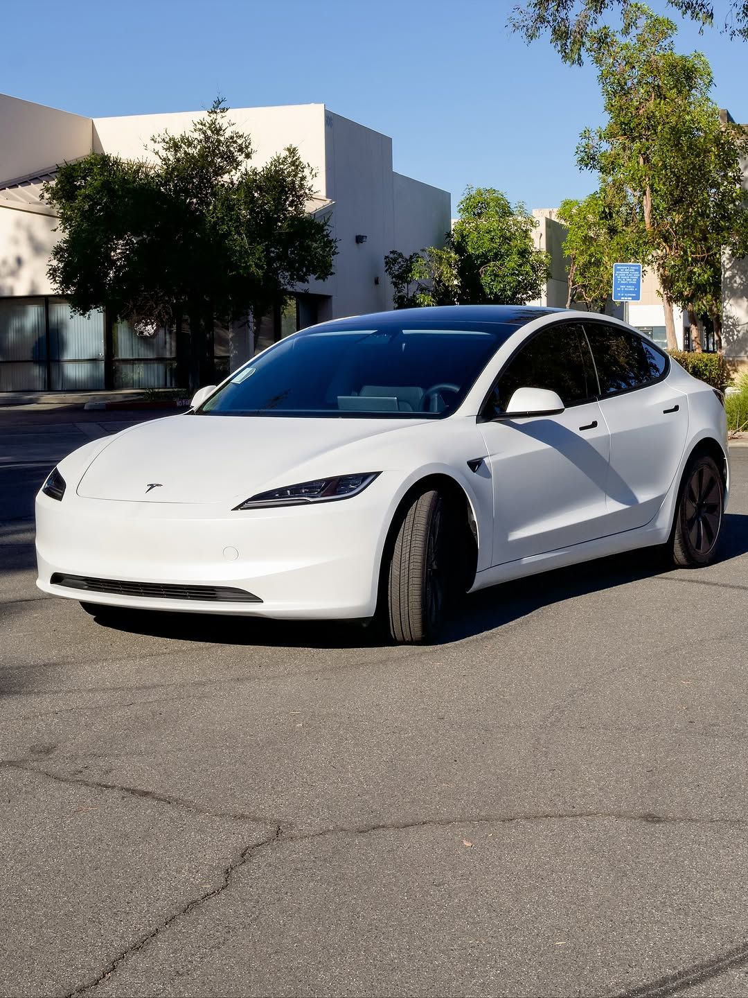 Tesla with PPF parked outside under the sun
