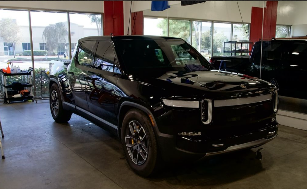 photos of black vehicle with ceramic coating parked outside