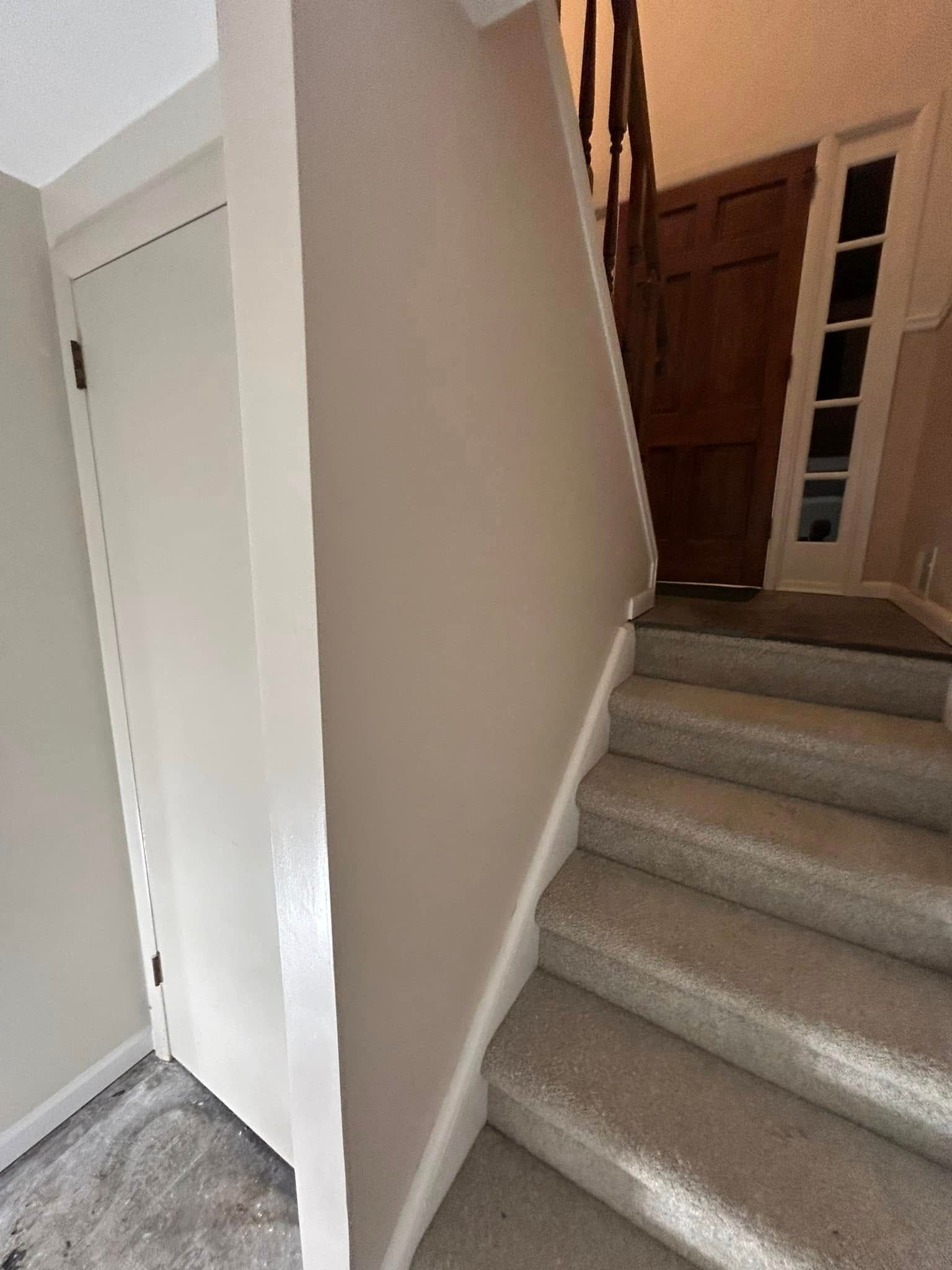 A set of stairs leading up to the second floor of a house.