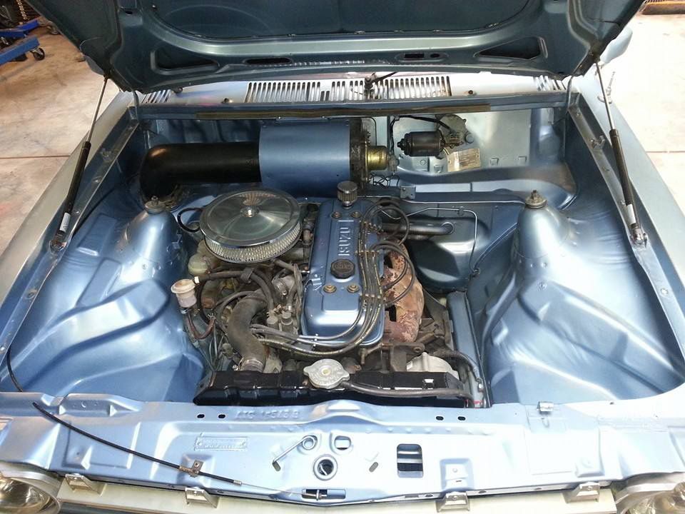 The Engine Of A Blue Car Is Shown With The Hood Open — Ballarat Auto Sparky in  Sebastopol, VIC