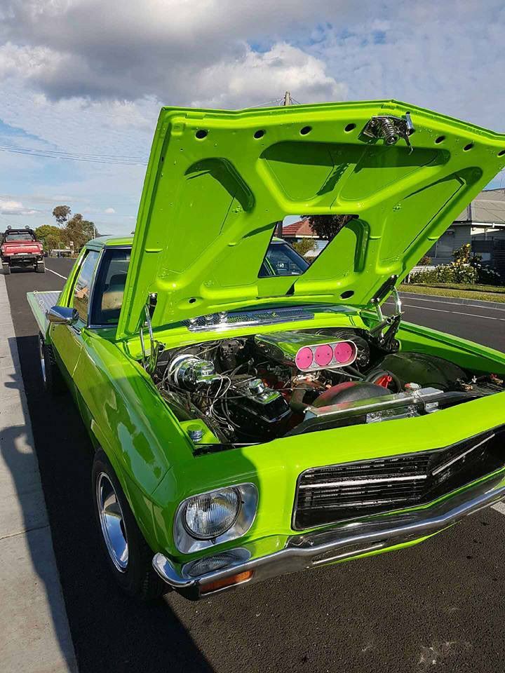 A Green Car With The Hood Up Is Parked On The Side Of The Road — Ballarat Auto Sparky in  Sebastopol, VIC
