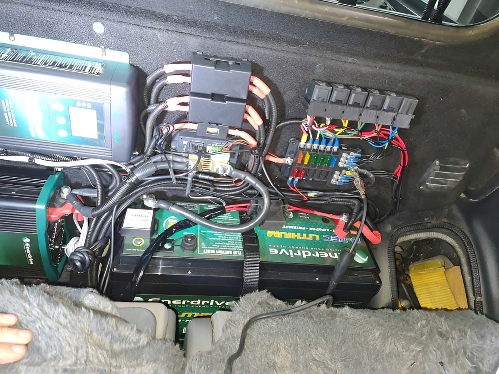 A Bunch Of Wires Are Coming Out Of The Trunk Of A Car — Ballarat Auto Sparky in  Sebastopol, VIC