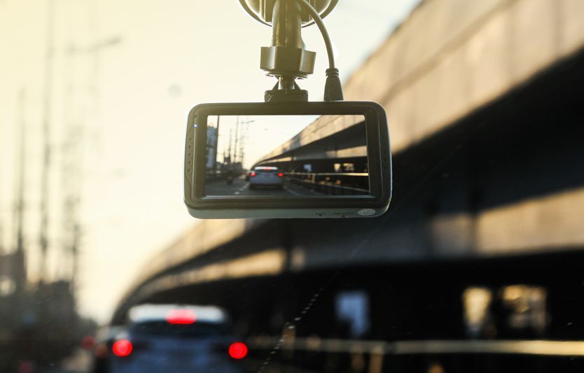 A Dash Cam Is Hanging From The Windshield Of A Car — Ballarat Auto Sparky in Sebastopol, VIC