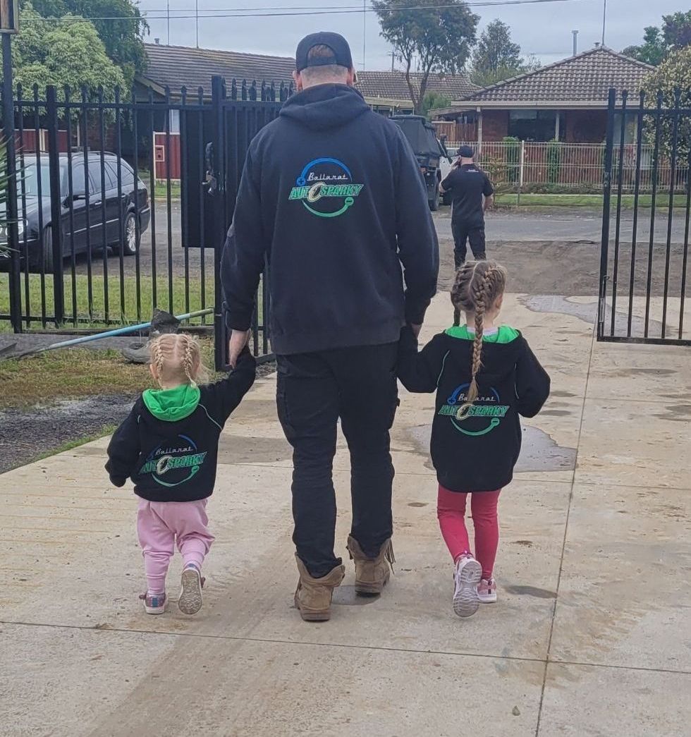 An Auto Sparky Holding Hands With His Daughter — Ballarat Auto Sparky in  Sebastopol, VIC