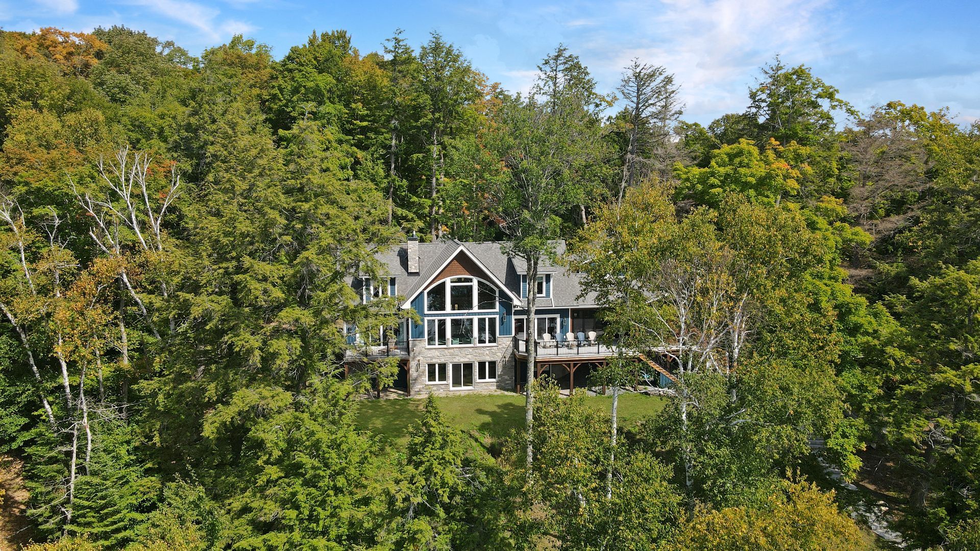 A staircase leading up to a house in the woods