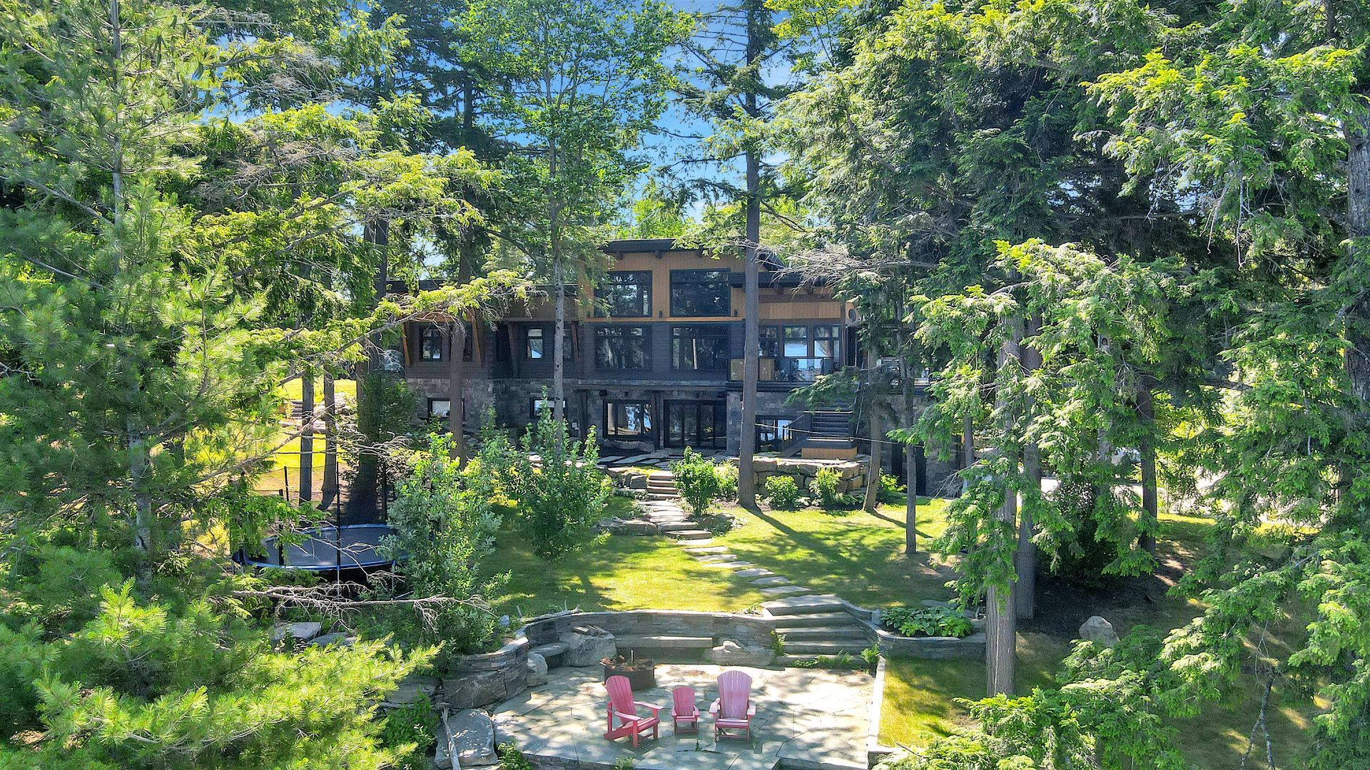 A staircase leading up to a house in the woods