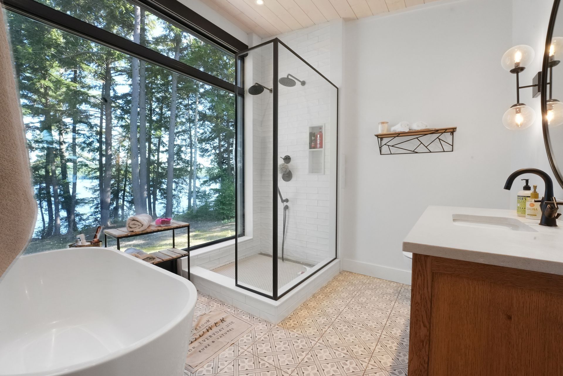 A bedroom with a large bed and a large window.