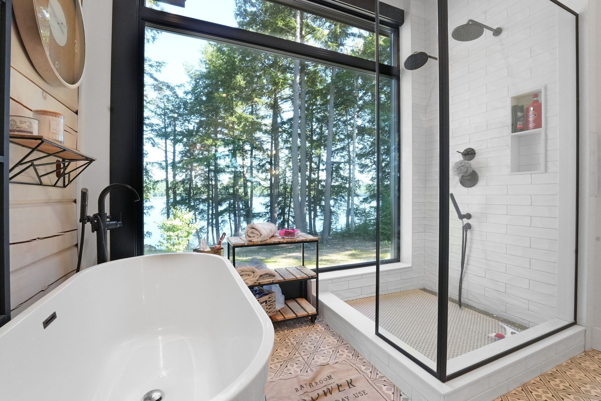 There is a hot tub on the patio of a house.