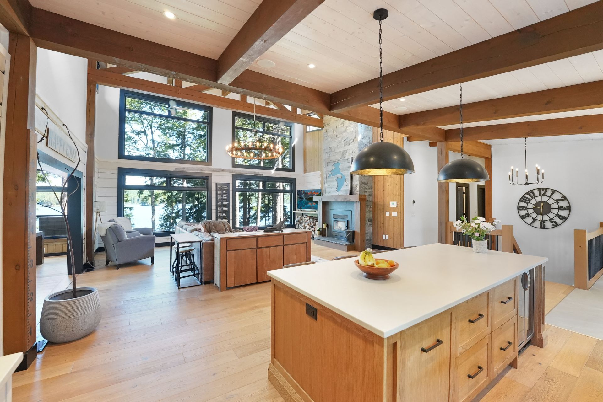 A living room with a fireplace and lots of windows