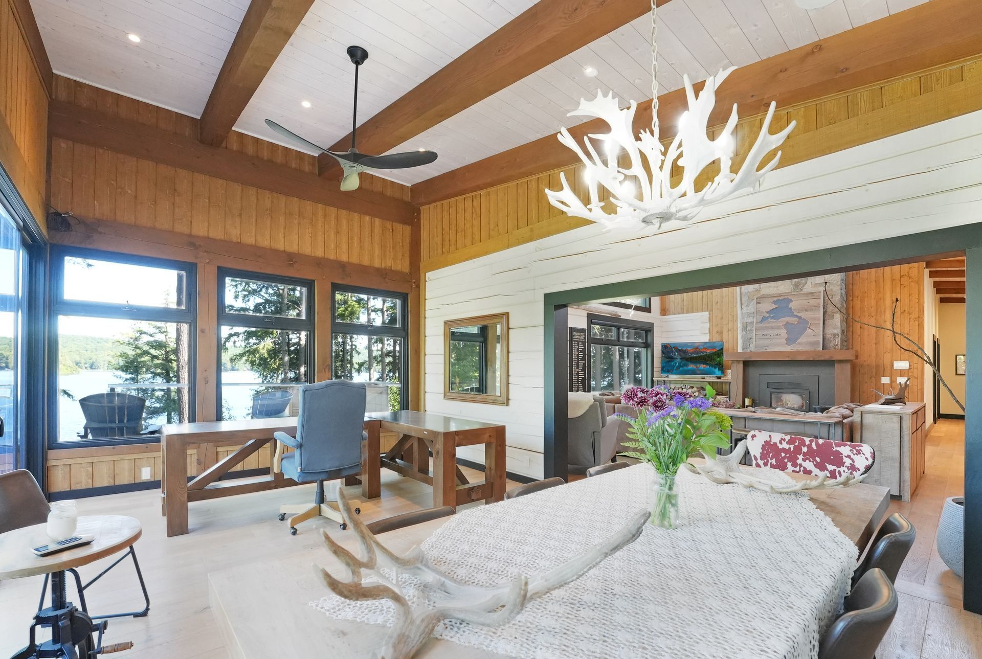 A room with a table and chairs in it