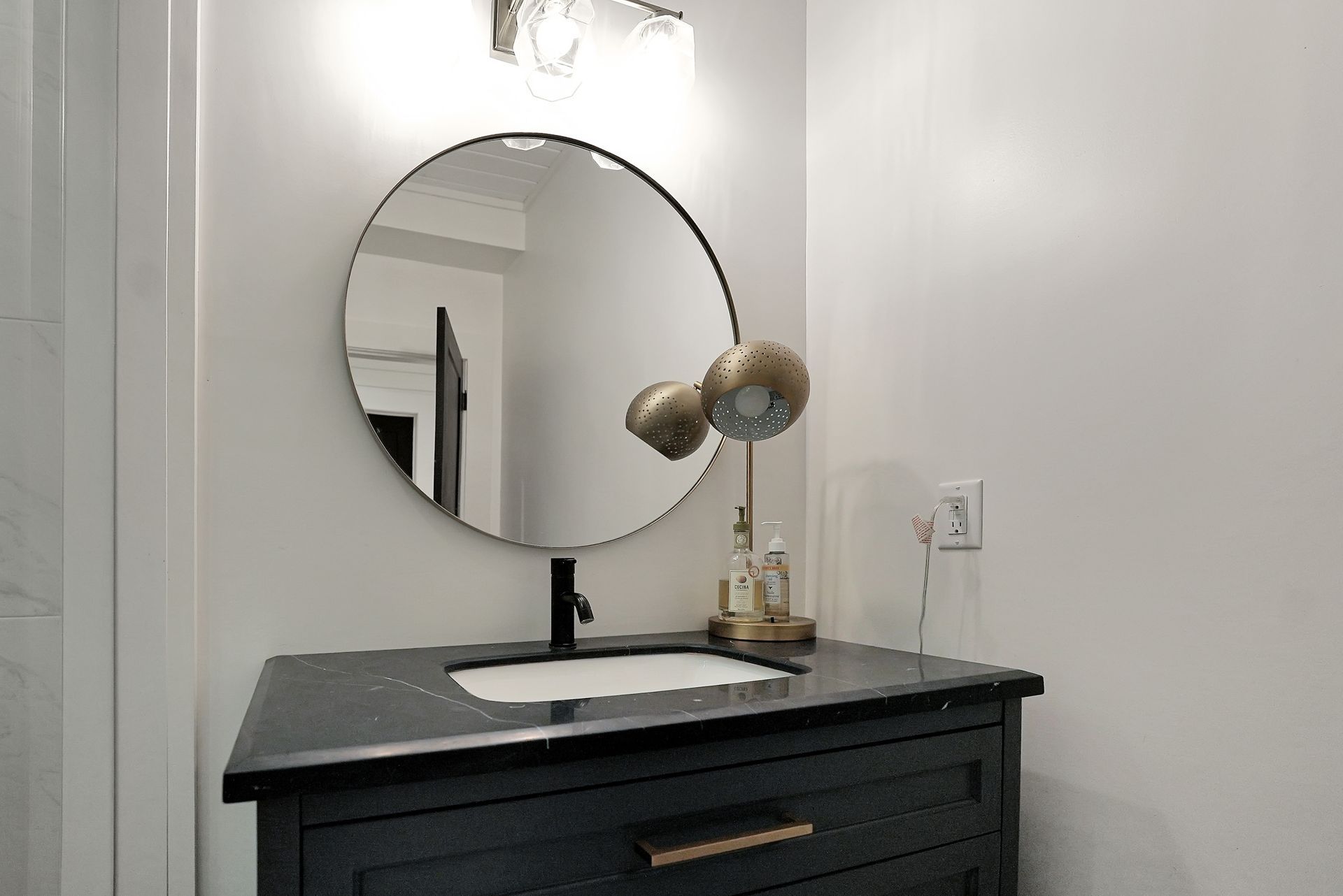 A bathroom with a sauna and a basket of towels
