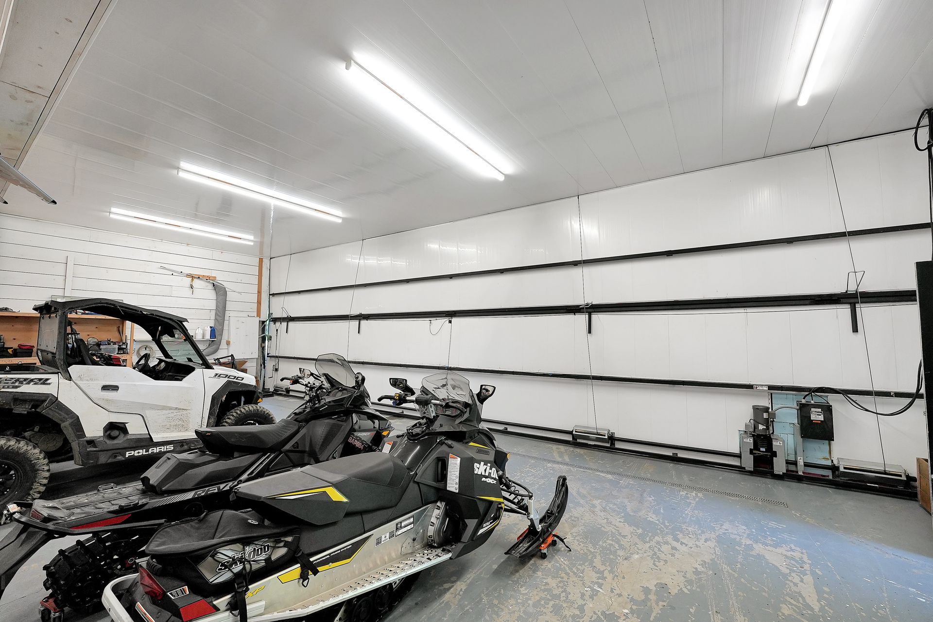 Two chairs are sitting on a dock overlooking a lake.
