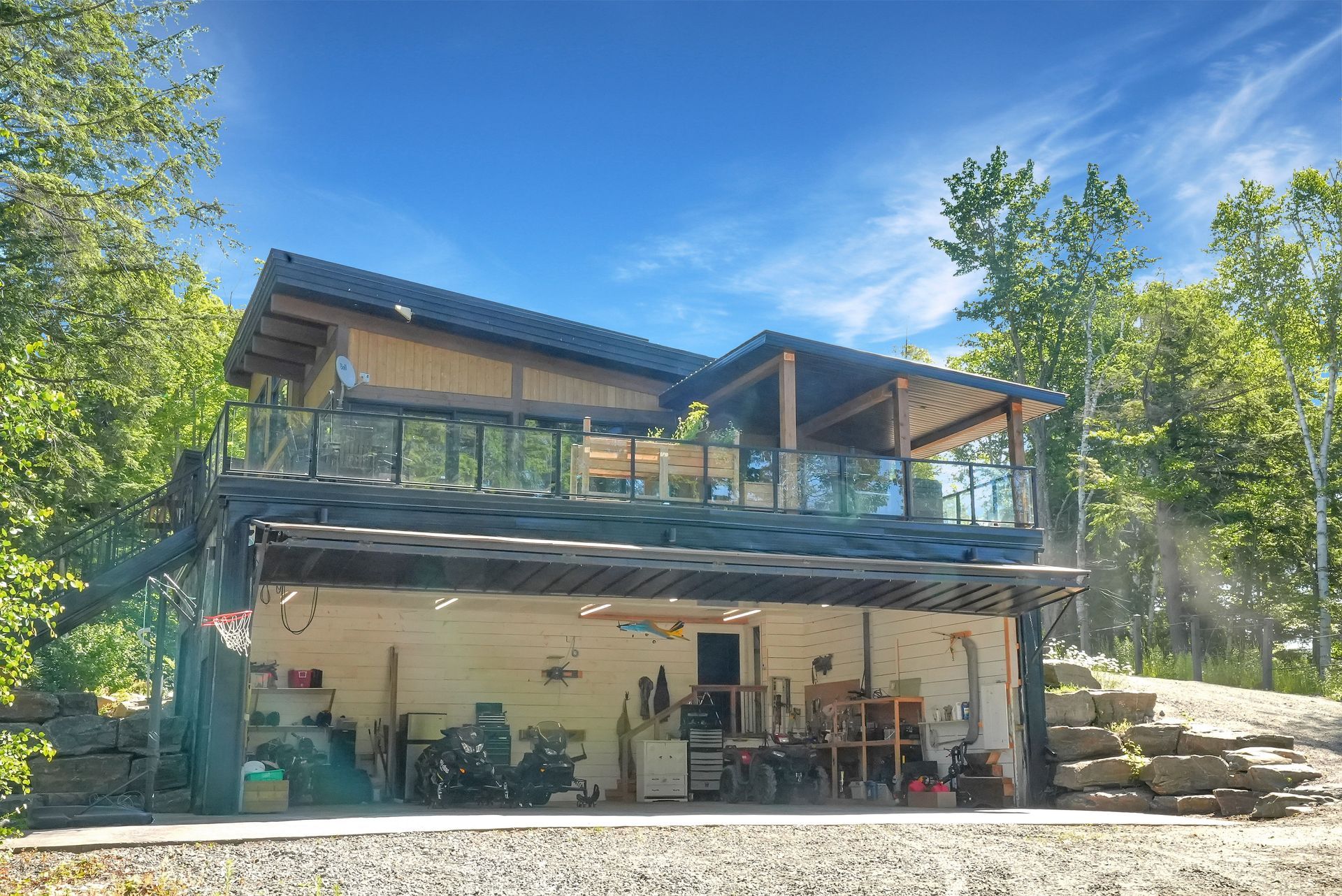 A wooden deck with a view of a lake and trees