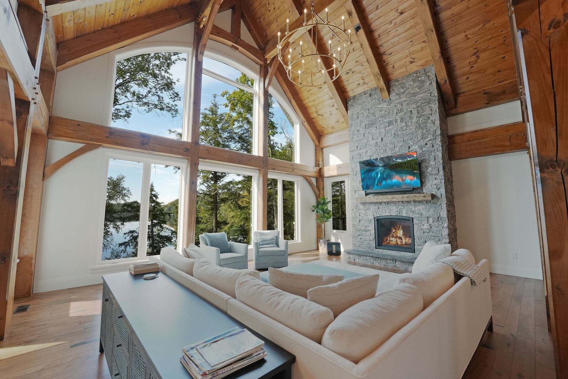 A small house with a porch in the middle of a forest.