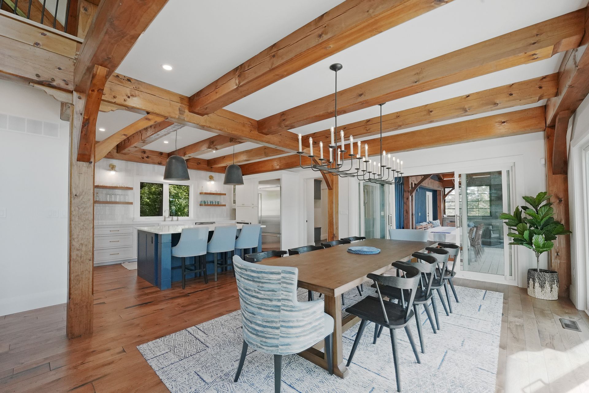 A kitchen with wooden cabinets and a large island