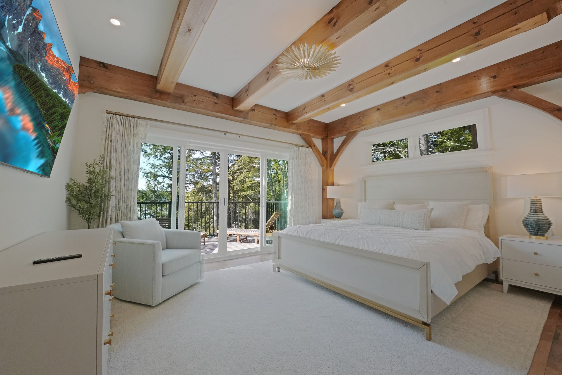 A bedroom with two bunk beds and lots of windows.