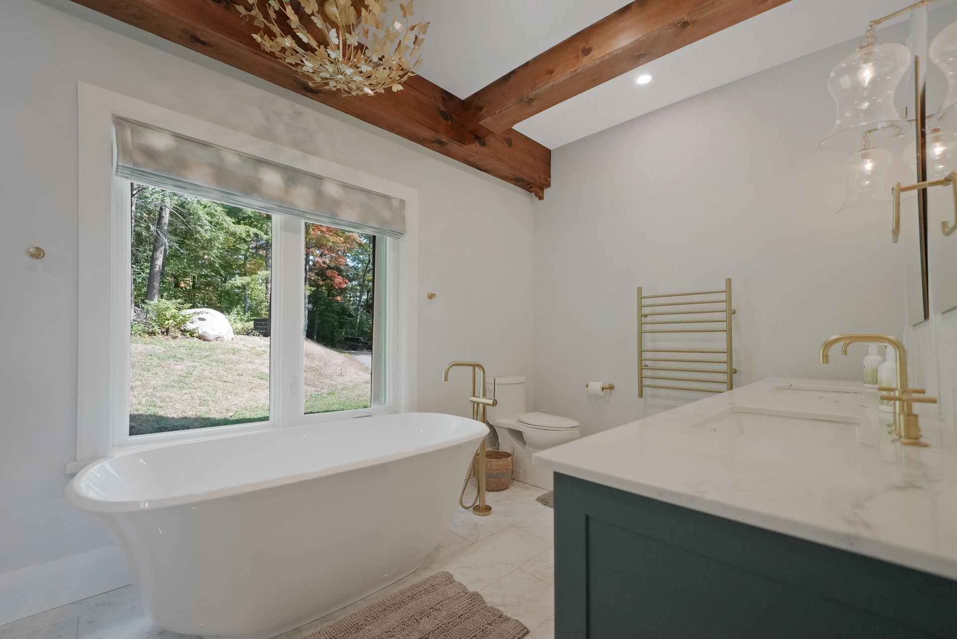 A bathroom with a sink , toilet , and sauna.