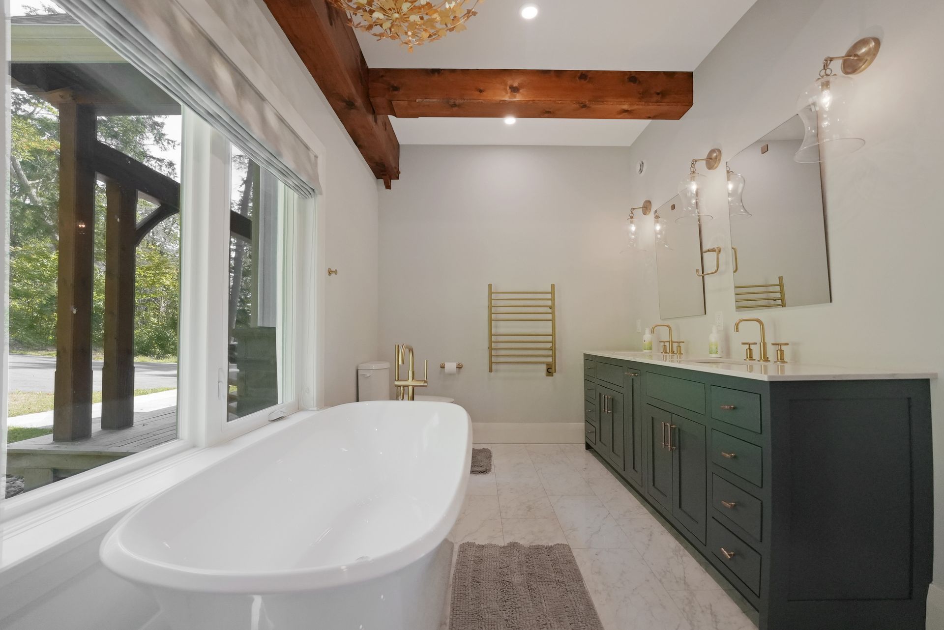 A bathroom with a toilet , sink , tub and shower.